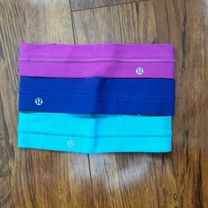 Lululemon headbands in pink, blue, and indigo